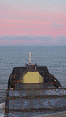 View from the wheelhouse on the deck and LNG tank located on the fore part of the empty container vessel. Container ship in ballast condition during sea passage in the North sea. © I am from Mykolayiv