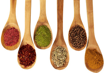 Spices On Wooden Spoons - Isolated