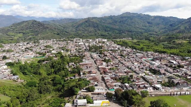 Aerial drone footage of Caicedonia town in Valle del Cauca Colombian coffee region
