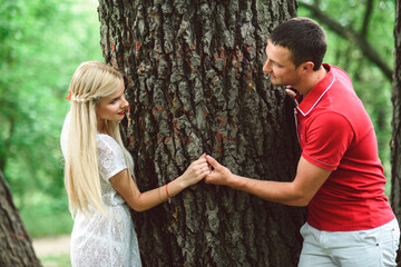 couple in love at a picnic in a park with green grass