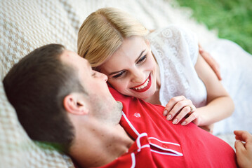 couple in love at a picnic in a park with green grass