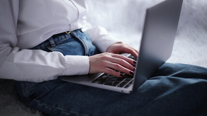 Female working at home office hand on keyboard close up. Businesswoman typing on laptop at workplace Woman working in home office hand keyboard
