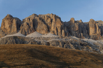 Fototapeta na wymiar Panoramic view of rocky mountains against sky, Dolomites, Pordoi Pass, Italy