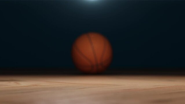 Slow motion Closeup basketball ball rolling on wooden floor in focus. 3D animation. Sport idea concept. Selective focus.