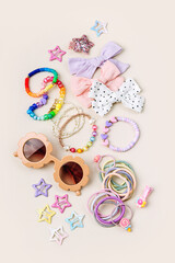 Set of baby girl hair accessories. Sunglasses with fashion hair bows, hair clips, hairpins and hair elastics.  Hairstyles for girls with stylish accessory.
