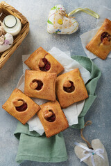 Valentines day heart shaped Hand pies. Mini puff pastry or hand pies stuffed with apple and sprinkle sugar powder in plate. Idea for homemade romantic snack Valentines day. Top view. Copy space.