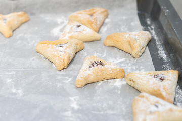 Jewish holiday Purim background with gluten-free hamantaschen or hamans ears cookies.