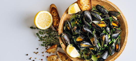 fragrant boiled mussels in herb and cream sauce - obrazy, fototapety, plakaty