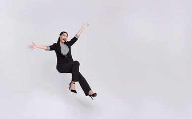 Fototapeta na wymiar Young beautiful smiling asian businesswoman floating in mid-air and announcement something isolated on white background.