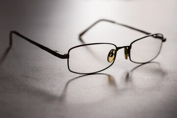 Eye Glasses with shadow on gray background