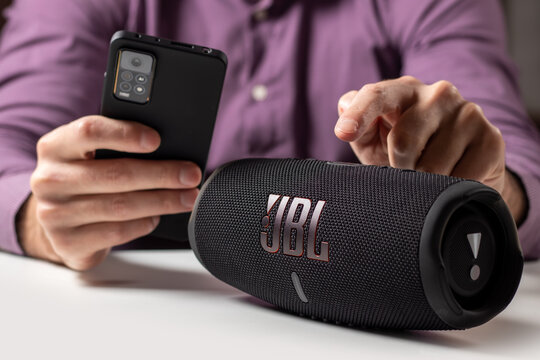 Dnioro Ukraine. 27 january 2023: Bluetooth speaker JBL Charge 5 with smart phone.