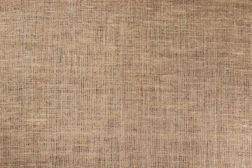 Jute hessian sackcloth canvas sack cloth woven texture pattern background in yellow beige cream...