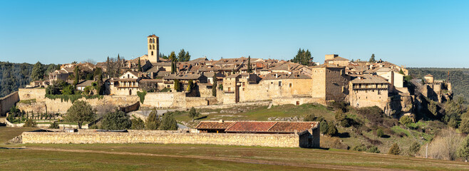 Panoramic view of the medieval city built on top of the hill with its old buildings, Pedraza, Segovia, Spain.