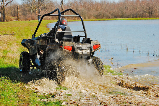 An ATV in mud and water