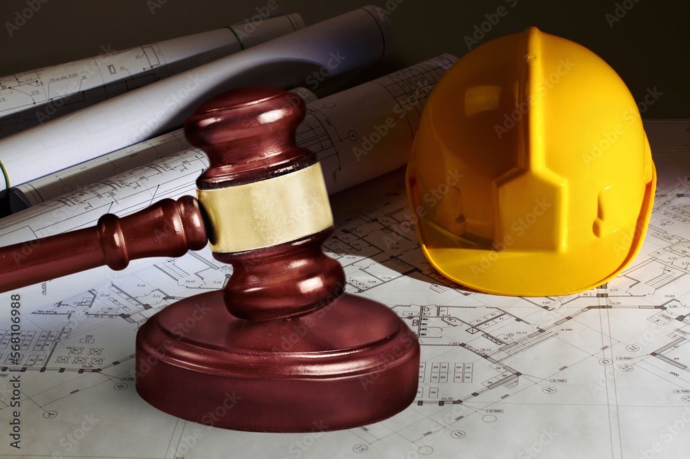 Poster Judge's wooden hammer and worker helmet on the desk