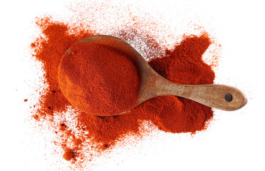Red paprika, cayenne pepper powder in wooden spoon pile isolated on white, top view 