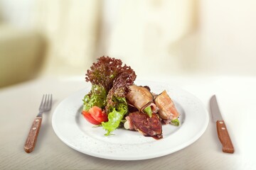 Chicken meat with tomato and salad on plate. Fastfood concept.