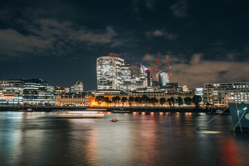 Fototapeta na wymiar Business district in London during the night long exposure United Kingdom