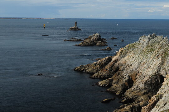View From Pointe Du Raz To The Lighthouse Phare De La Vielle In Bretagne France On A Beautiful Sunny Summer Day With A Few Clouds In The Sky