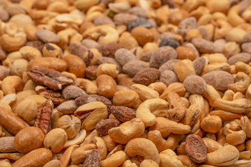 A group of almonds, pistachios, walnuts, macadamia, cashews.