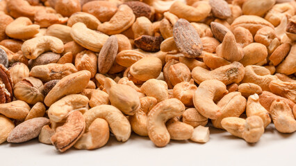 A group of almonds, pistachios, walnuts, macadamia, cashews.
