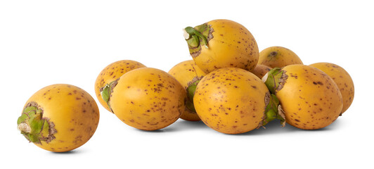 pile of fresh and yellow husk areca nuts, fruit of the areca palm, areca nut palm or betel palm, scattered tropical and commercially important fruits isolated