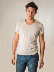 Obraz premium Handsome and fit young man standing on white background