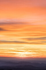 Orange sky and beautiful cloudscape on fire during sunrise