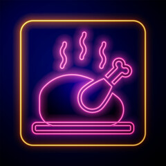 Glowing neon Roasted turkey or chicken icon isolated on black background. Vector