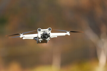 

DJI Mavic mini hovering mid air with bokeh background