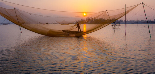 Catch fish in the river at dawn