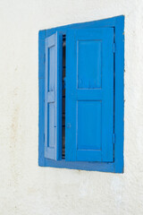 Characteristic blue window in Chora village, Folegandros island GR