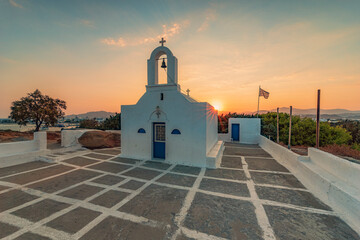 Sun rise behind the small chapel of Agios Nikolaos in Agia Anna village, Naxos island GR