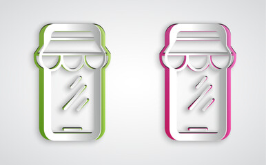 Paper cut Online shopping on mobile phone icon isolated on grey background. Internet shop, mobile store app and payments billing. Paper art style. Vector