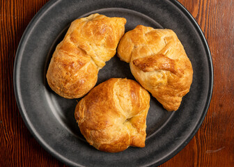Three croissants on a plate