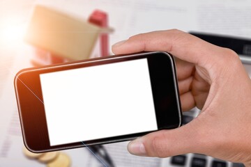 Hands hold a phone with a blank screen