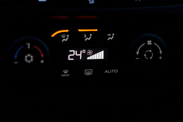 Display of the climate system of a modern car in the dark