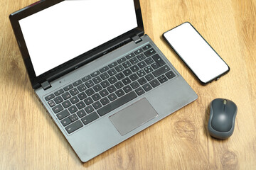 laptop with smartphone and computer mouse on boards