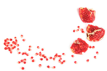 Grains and chunks of pomegranate isolated on white background. Free space for text.
