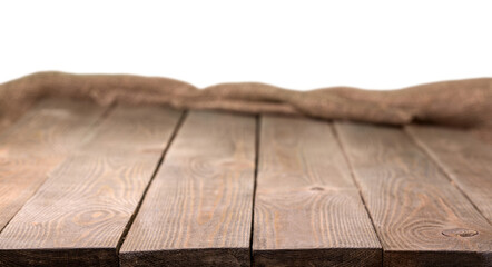 Old wooden table with a piece of burlap