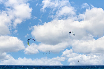 People practicing kitesurfing on the beach of Los Caños de Meja, next to the Trafalgar Lighthouse,...