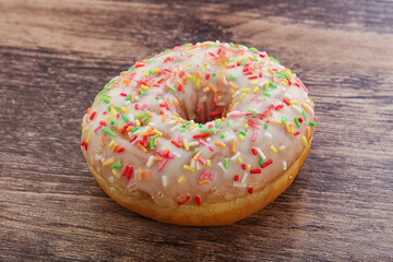 Sweet glazed vanilla donut with icing