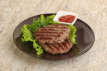 Grilled beef burger cutlet with sauce