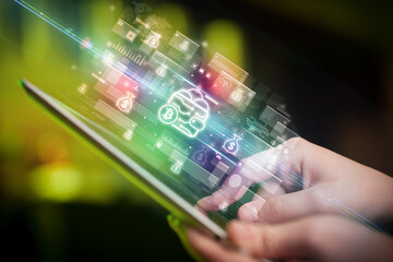 Close-up of a hand using tablet, currency concept