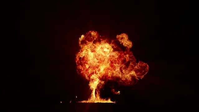 Impressive intense explosion on a black background. Dynamic composition of a detonating bright colorful explosion, shock wave and puffs of smoke filling the space
