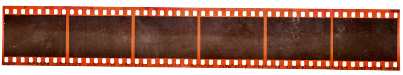 real macro photo of long 35mm filmstrip with empty frames or cells. film material with dust. blank photo mock up.