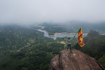 Srilankan flag on top of the peacock hill mountain