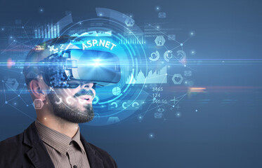 Businessman looking through VR glasses