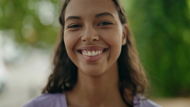 Young african american woman smiling confident standing at park