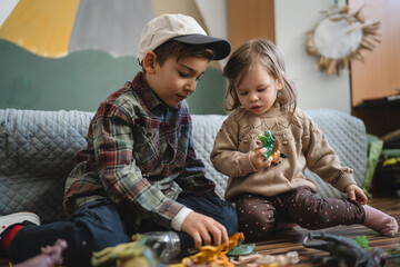 siblings brother and sister boy and girl children toddler play at home